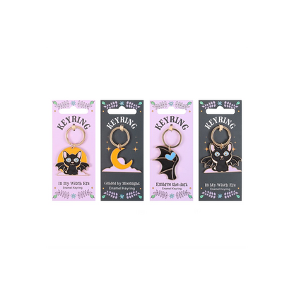 Set of 24 Cute and Creepy Keyrings on Display